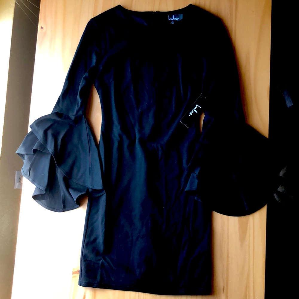XS. Rich black color,bell sleeves, never worn.